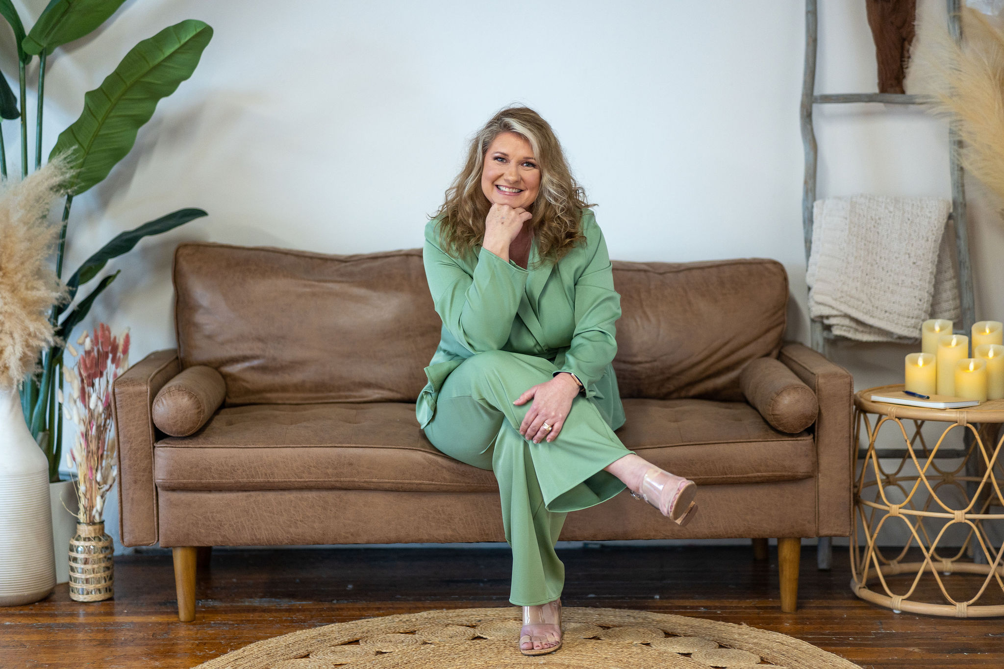 Dr. Jennifer Culver smiling on couch